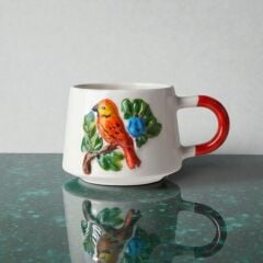 Turuncu Kuş Figürlü Kabartma Seramik Kupa